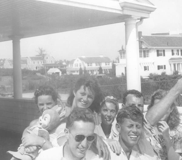 Ethel Skakel Kennedy (L) with John F. Kennedy and others sitting on the deck of the Kennedy family home in Hyannis, Massachusetts, ca 1950.  Courtesy JFK Library
