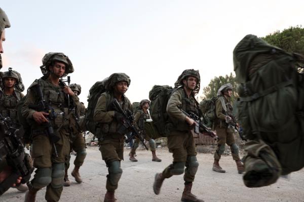 Israeli troops are being sent out in force to control the Gaza border in preparation for an invasion into the Palestinian territory.
